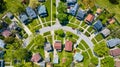 Aerial houses on circular road HOA neighborhood green summer lawns landscaping