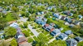 Aerial houses city blocks neighborhood green summer lawns HOA asset