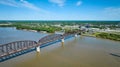 Aerial iron arch bridge over Ohio River water murky distant city blue sky Royalty Free Stock Photo