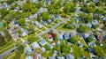 Aerial neighborhood houses green lawn landscaping HOA downtown housing trampoline