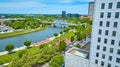 Aerial next to building showcasing Scioto Mile Promenade and river through Columbus Ohio