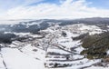 Image of aerial photography with drone of town Grafenau in Bavarian forest with mountains Arber Rachel and Lusen in winter with sn