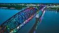 Aerial pride rainbow arch bridge Louisville KY over nighttime Ohio River city lights at night Royalty Free Stock Photo