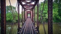 Aerial of train tracks over river with metal frame Royalty Free Stock Photo