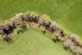 Image of aerial view of naturally meandering stream river kleine Ohe with trees on bank surrounded by green fields meadows in Bava