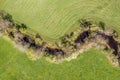 Image of aerial view of naturally meandering stream river kleine Ohe with trees on bank surrounded by green fields meadows in Bava