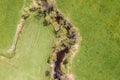 Image of aerial view of naturally meandering stream river kleine Ohe with trees on bank surrounded by green fields meadows in Bava