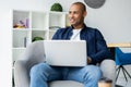 Image of african american businessman working on his laptop. Handsome young man at his desk Royalty Free Stock Photo