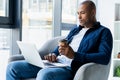 Image of african american businessman working on his laptop. Handsome young man at his desk Royalty Free Stock Photo