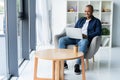 Image of african american businessman working on his laptop. Handsome young man at his desk Royalty Free Stock Photo