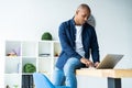 Image of african american businessman working on his laptop. Handsome young man at his desk Royalty Free Stock Photo