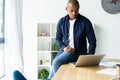 Image of african american businessman working on his laptop. Handsome young man at his desk Royalty Free Stock Photo