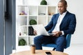 Image of african american businessman working on his laptop. Handsome young man at his desk. Royalty Free Stock Photo