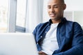 Image of african american businessman working on his laptop. Handsome young man at his desk Royalty Free Stock Photo