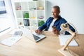 Image of african american businessman working on his laptop. Handsome young man at his desk Royalty Free Stock Photo