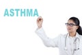African female physician writing asthma word