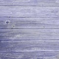 Aged rustic wooden background texture in violet color