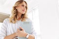 Image of alluring elegant secretary woman holding clipboard in office