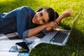 Beautiful young woman student in the park using laptop computer. Royalty Free Stock Photo