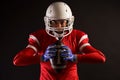 Image of american female football player in helmet with rugby ball in hands Royalty Free Stock Photo