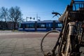 Image of Amsterdam Tram with a bike wreck in the foreground