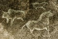 An image of ancient animals depicted on the wall of a cave. Royalty Free Stock Photo