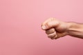 angry hand gesture on Pink background