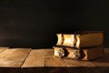 Image of antique books, with brass clasps on old wooden table Royalty Free Stock Photo