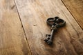 Image of antique key on old wooden table Royalty Free Stock Photo