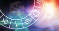Image of aquarius star sign symbol in spinning horoscope wheel over glowing stars