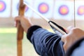 Archer holds his bow aiming at a target Royalty Free Stock Photo