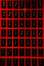 Image of an array of assorted golden keys in vibrant red frames