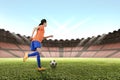 Image of asian female footballer kicking the ball Royalty Free Stock Photo