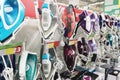 Image of assortment of different irons at household appliances shop
