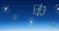 Image of atom models spinning on blue background Royalty Free Stock Photo