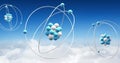 Image of atom models spinning over clouds on blue background Royalty Free Stock Photo