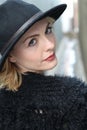 Image of attractive blond female wearing black hat, closeup portrait of stylish elegant woman, beautiful girl Royalty Free Stock Photo