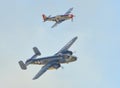 B-25 Mitchell Bomber and escorts flying on clear sky