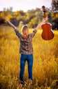 Image from the back of a happy young woman on the plaid shirt an Royalty Free Stock Photo