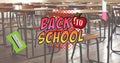 Image of back to school text and school items over classroom Royalty Free Stock Photo