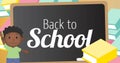 Image of back to school text over board