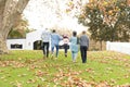 Image of back view of multi generation african american family having fun outdoors in autumn Royalty Free Stock Photo