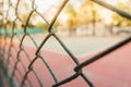 Image for background of tennis and basketball court behind grille