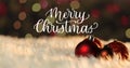 Image of baubles over merry christmas text Royalty Free Stock Photo