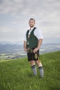 Bavarian tradition man in the grass Royalty Free Stock Photo