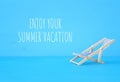 image of beach chair over blue background. Royalty Free Stock Photo