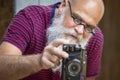 A bearded man taking a photograph Royalty Free Stock Photo