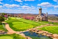 Beautiful church in mountains on clean golf course Royalty Free Stock Photo