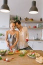 Image of beautiful couple in love preparing breakfast Royalty Free Stock Photo