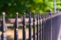 Image of a Beautiful decorative cast iron wrought fence with artistic forging. Metal guardrail close up Royalty Free Stock Photo